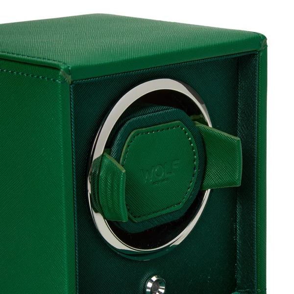 Close up side view of an open CUB Winder in green vegan leather