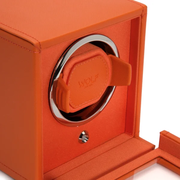 Close up side view of an open CUB Winder in orange vegan leather